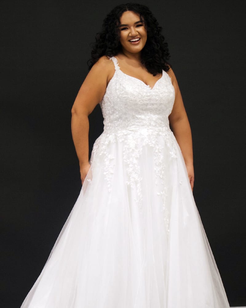 Front of a model wearing a size 22 Ella Bridal Dress in Ivory by Sydney's Closet. | dia_product_style_image_id:285913